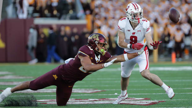 Wisconsin safety Scott Nelson (No. 9) intercepting a pass against Minnesota (Credit: Mark Hoffman / Milwaukee Journal Sentinel / USA TODAY NETWORK)